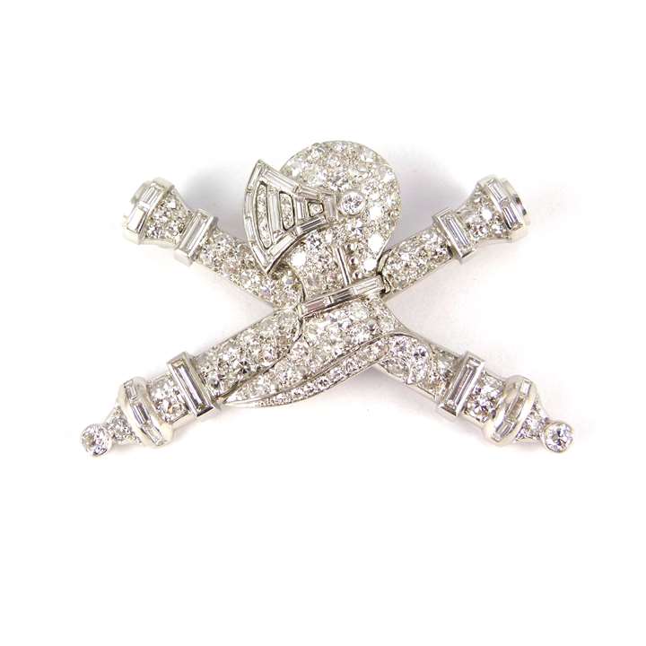 Diamond and platinum knight's helmet and crossed batons brooch